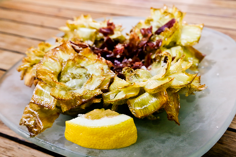 A ración of alcachofas fritas con jamon - fried artichokes with jamon